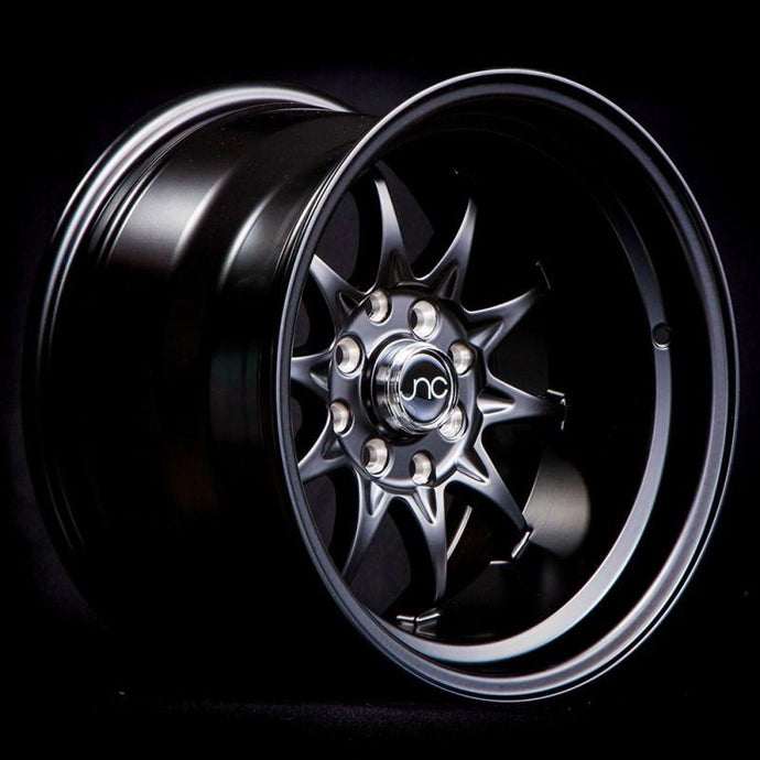 JNC003 | Matte Black | 15x8 | 4x100/4x114.3 | +0mm | CB: 73.1