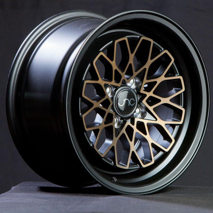 JNC040 | Matte Black Bronze Face | 15x8 | 4x100 | +25mm | CB: 73.1