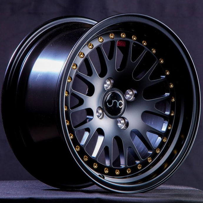 JNC001 | Matte Black w/ Gold Rivets | 16x8 | 4x100/4x114.3 | +25mm | CB: 73.1
