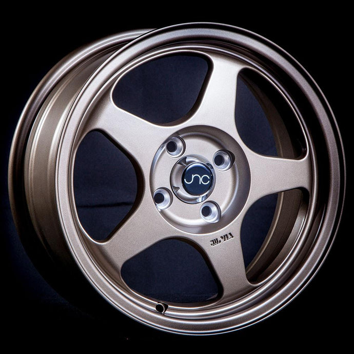 JNC018 | Matte Bronze | 15x6.5 | 4x100 | +35mm | CB: 73.1