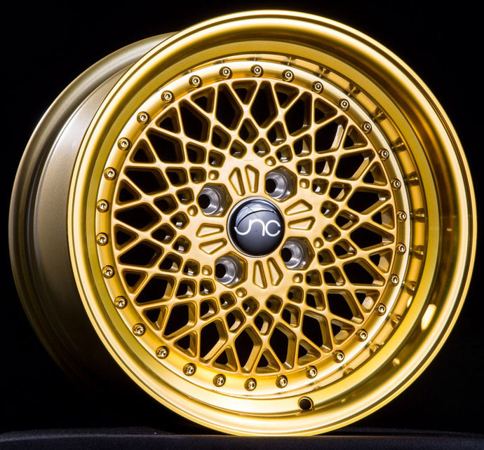JNC045 | Transparent Gold w/ Gold Rivets | 15x8.25 | 4x100 | +10mm | CB: 73.1
