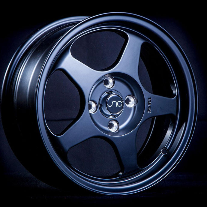 JNC018 | Matte Black | 15x7.5 | 4x100 | +33mm | CB: 73.1