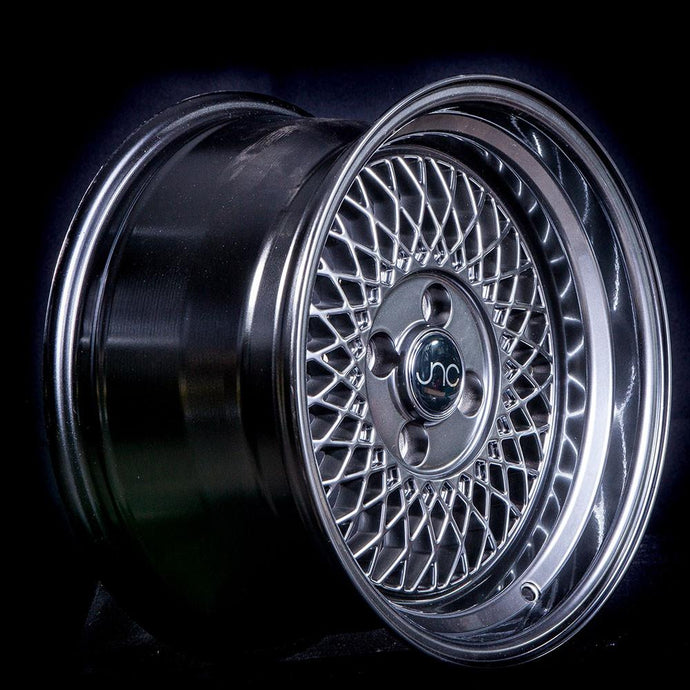 JNC031 | Hyper Black Machine Lip | 15x8 | 4x100 | +25mm | CB: 73.1
