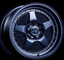 JNC009 | Matte Black Gold Rivets | 15x8 | 4x100/4x114.3 | +25mm | CB: 73.1