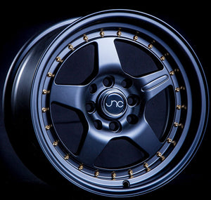 JNC009 | Matte Black Gold Rivets | 15x8 | 4x100/4x114.3 | +25mm | CB: 73.1