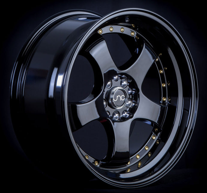 JNC017 | Gloss Black w/ Gold Rivets | 18x8.5 | 5x100/5x114.3 | +30mm | CB: 73.1