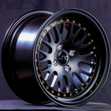 JNC001 | Matte Black w/ Gold Rivets | 15x8 | 4x100 | +25mm | CB: 73.1