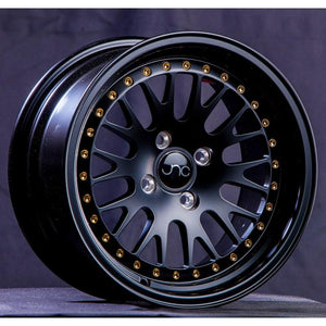 JNC001 | Matte Black w/ Gold Rivets | 16x8 | 4x100/4x114.3 | +25mm | CB: 73.1