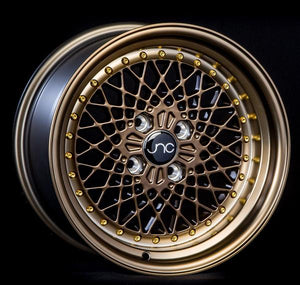 JNC045 | Machined Bronze w/ Gold Rivets | 15x8.25 | 4x100 | +10mm | CB: 73.1