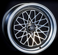 JNC040 | Matte Black Machined Face | 15x8 | 4x100 | +25mm | CB: 73.1
