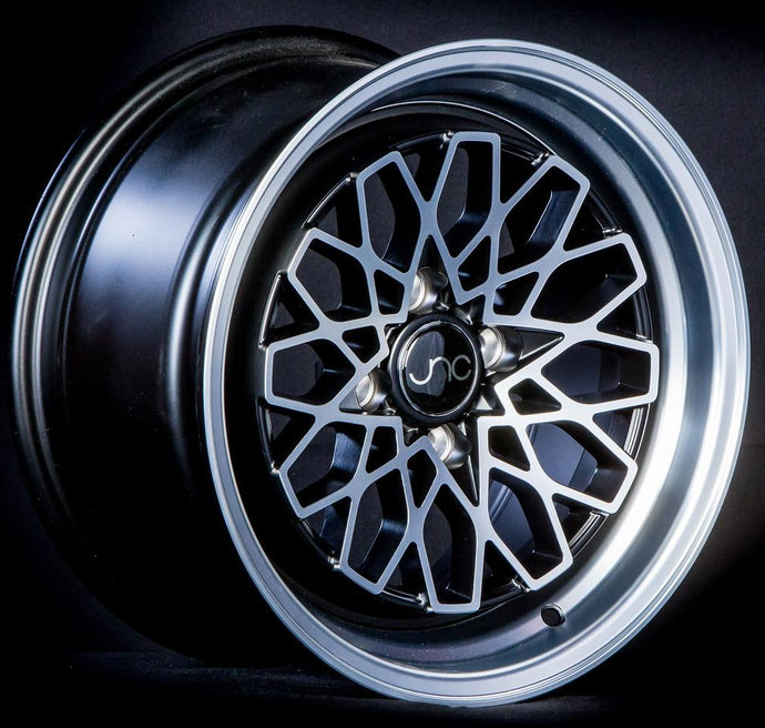 JNC040 | Matte Black Machined Face | 15x8 | 4x100 | +25mm | CB: 73.1